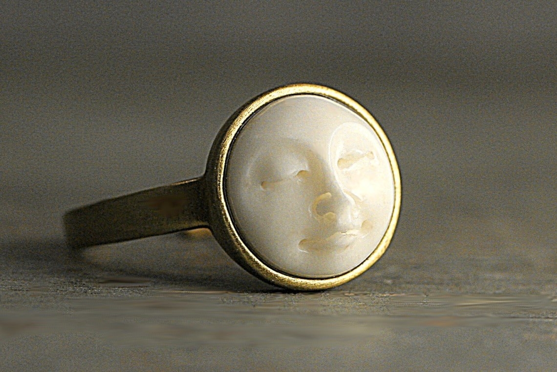 brass ring with white moon face gemstone
