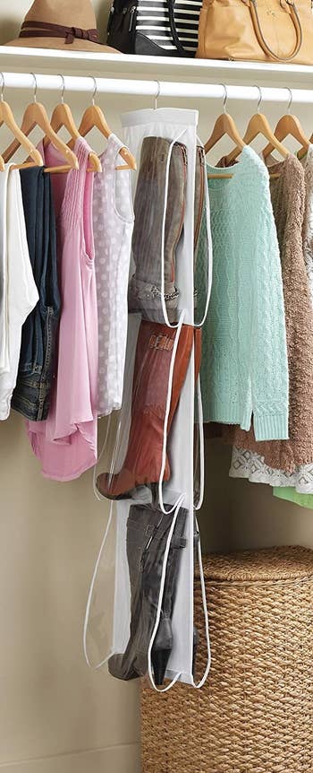 Three pairs of boots placed in hanging closet organizer