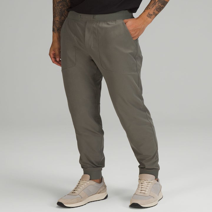 another model wearing the khaki-colored joggers