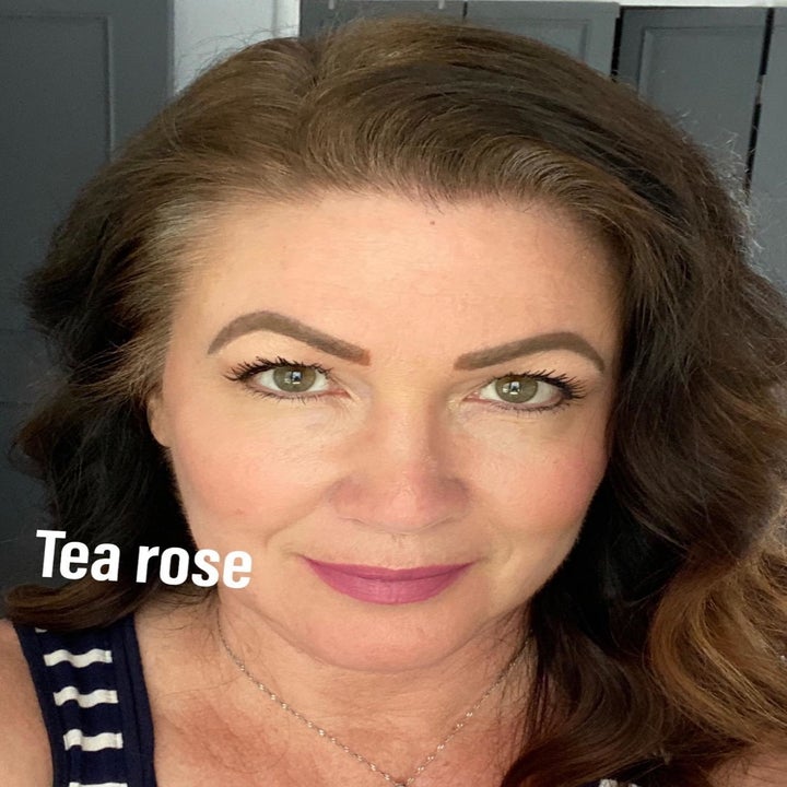 Reviewer is wearing one of the lipstick shades called Tea Rose