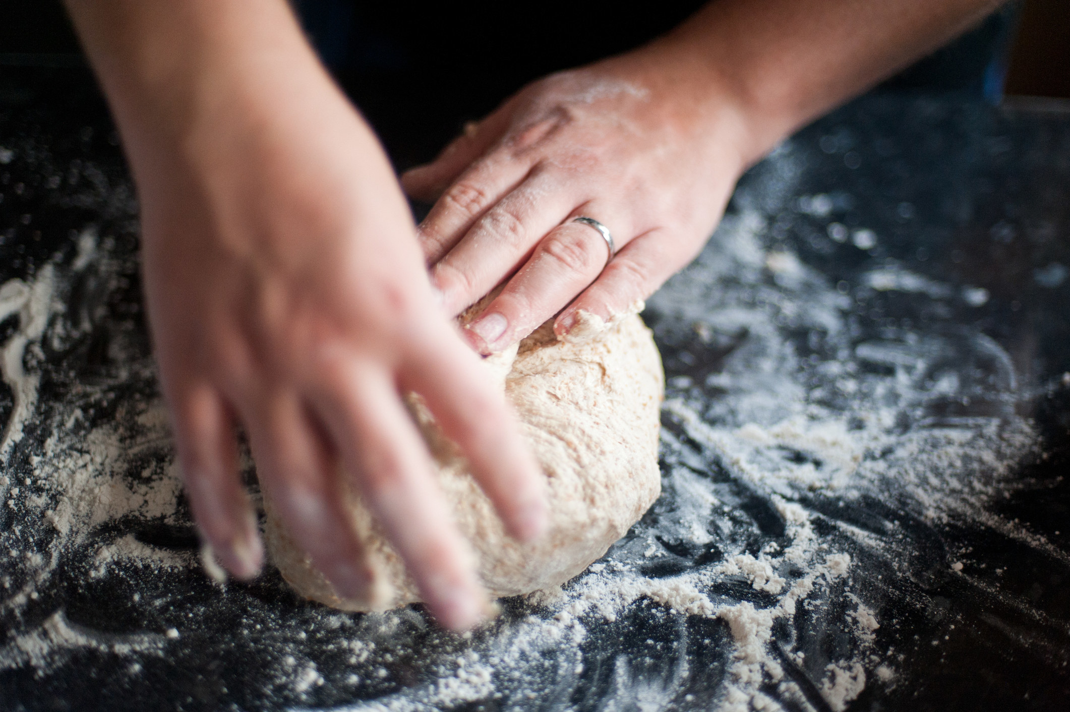Man kneading bread dough.