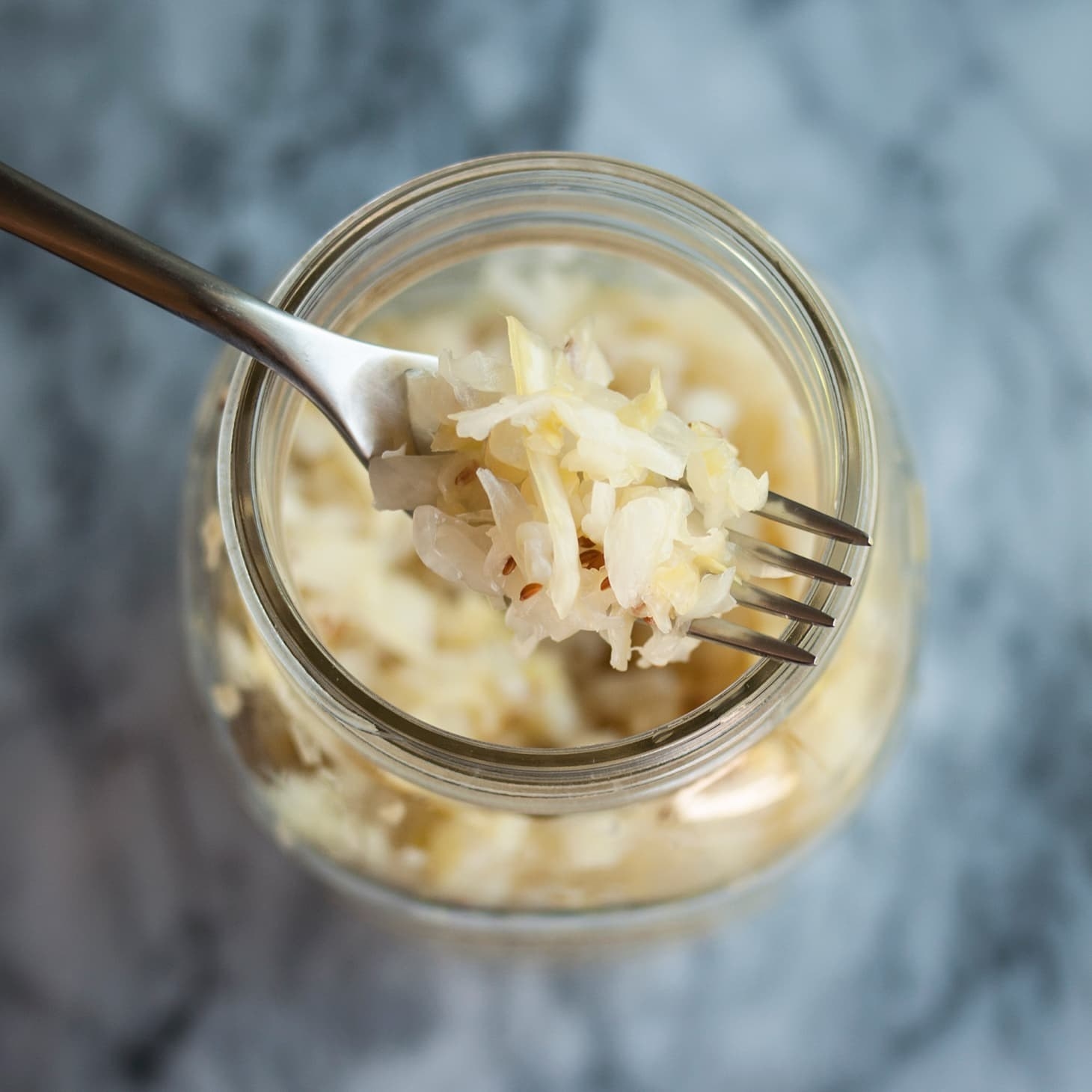 A mason jar filled with sauerkraut.