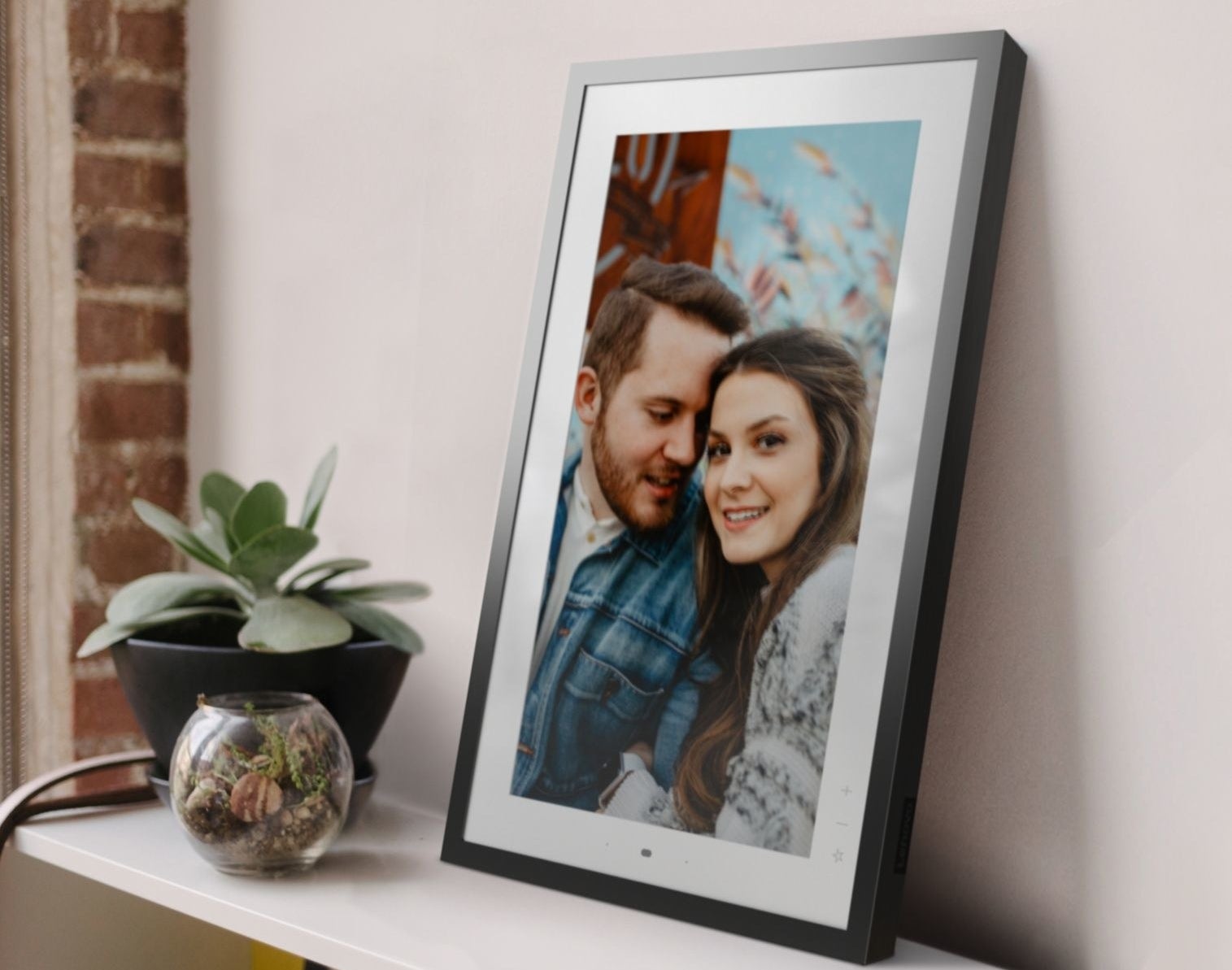 A metallic grey smart digital photo frame