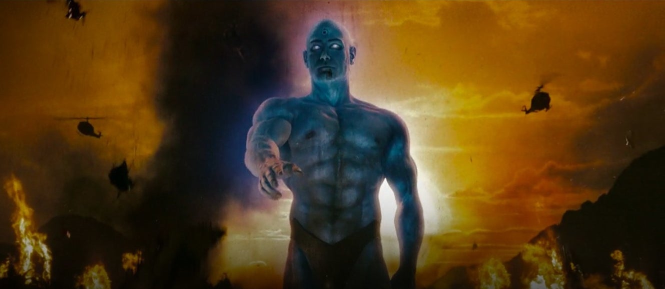 A giant Dr. Manhattan walking through Vietnam with fire and helicopters around him in &quot;Watchmen&quot;