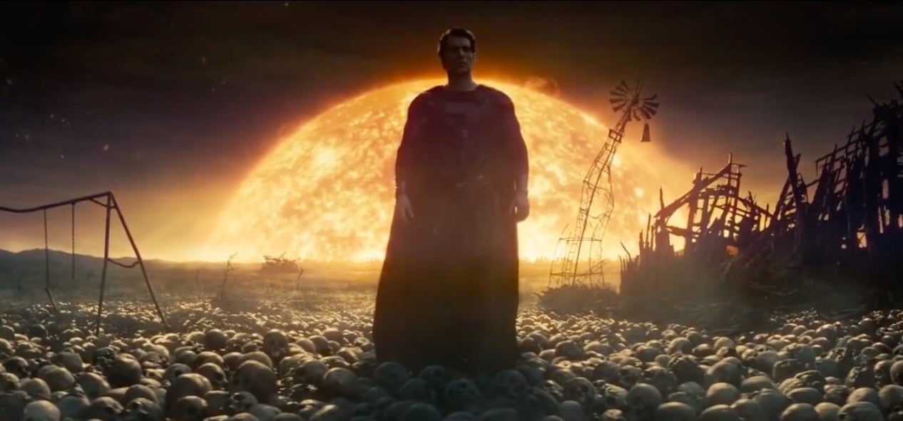 Superman standing over countless human skulls with the sun behind him in &quot;Man of Steel&quot;