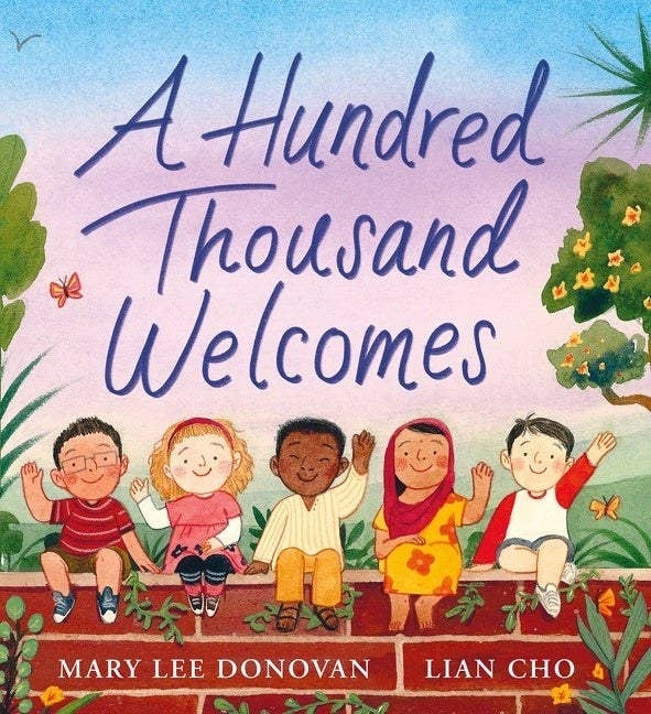 Five children from around the world sit outside on a brick wall, waving to the reader. Text above them reads: A Hundred Thousand Welcomes