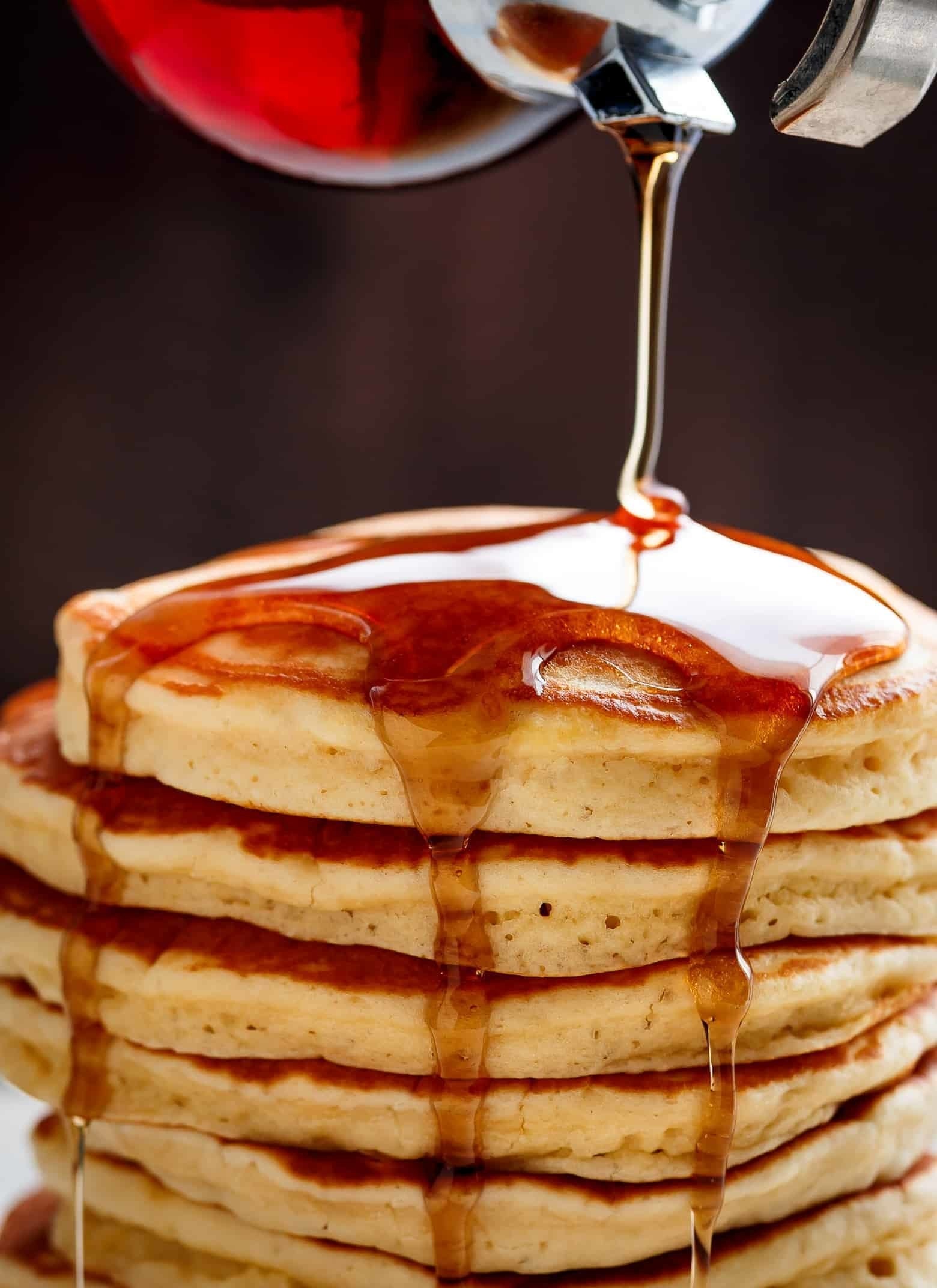 Fluffy pancakes topped with syrup.