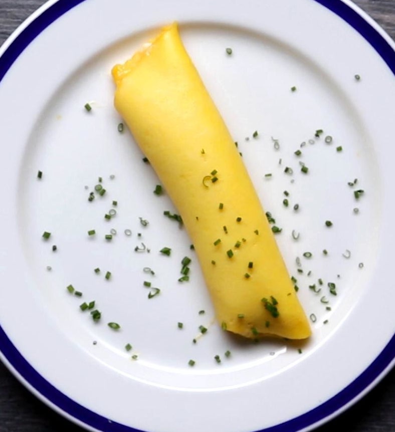 A French omelette topped with chives.