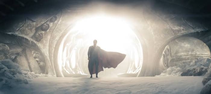 Superman emerging from the Kryptonian Scout Ship in his red and blue suit in &quot;Man of Steel&quot;