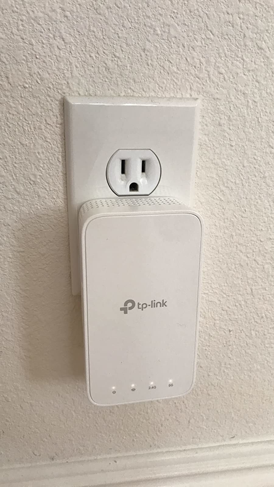 Reviewer&#x27;s WiFi extender plugged into wall