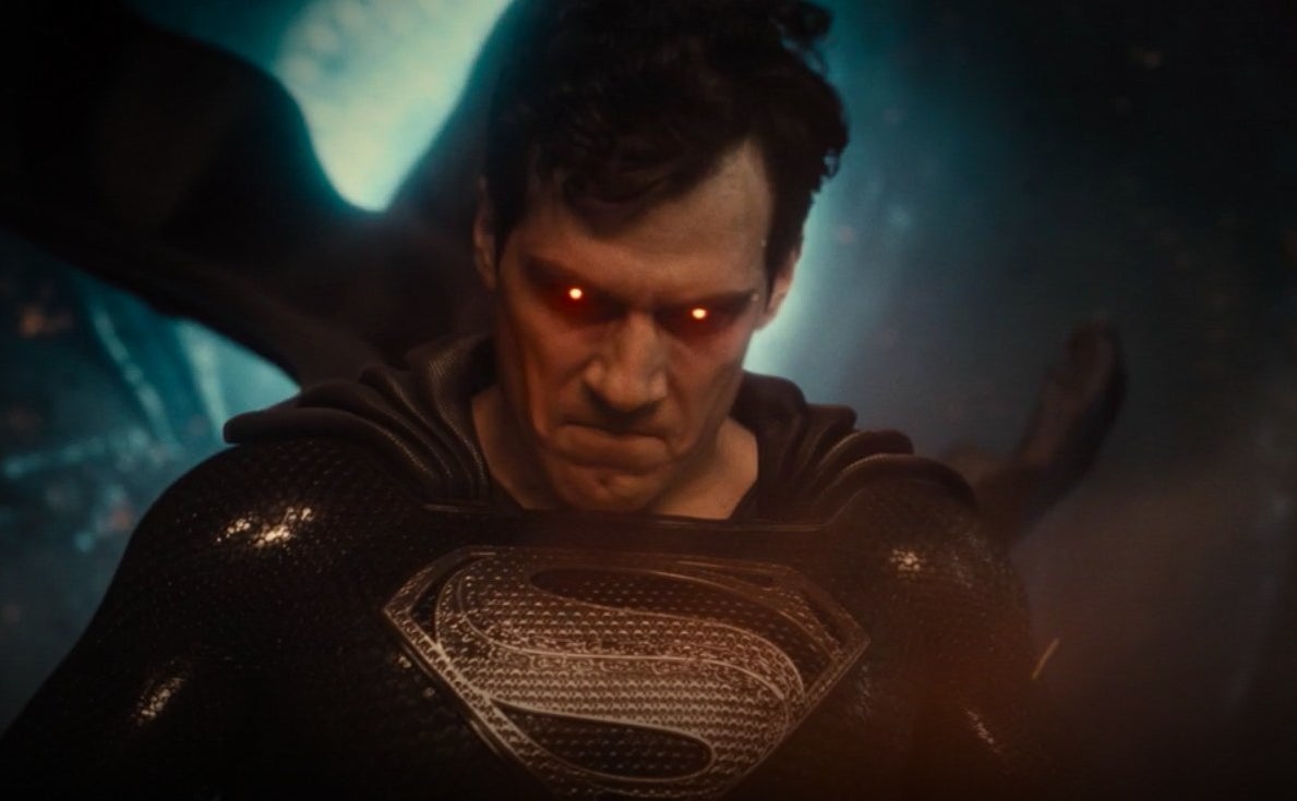 Superman wearing a black suit with red eyes standing in front of a Boom Tube in &quot;Zack Snyder&#x27;s Justice League&quot;