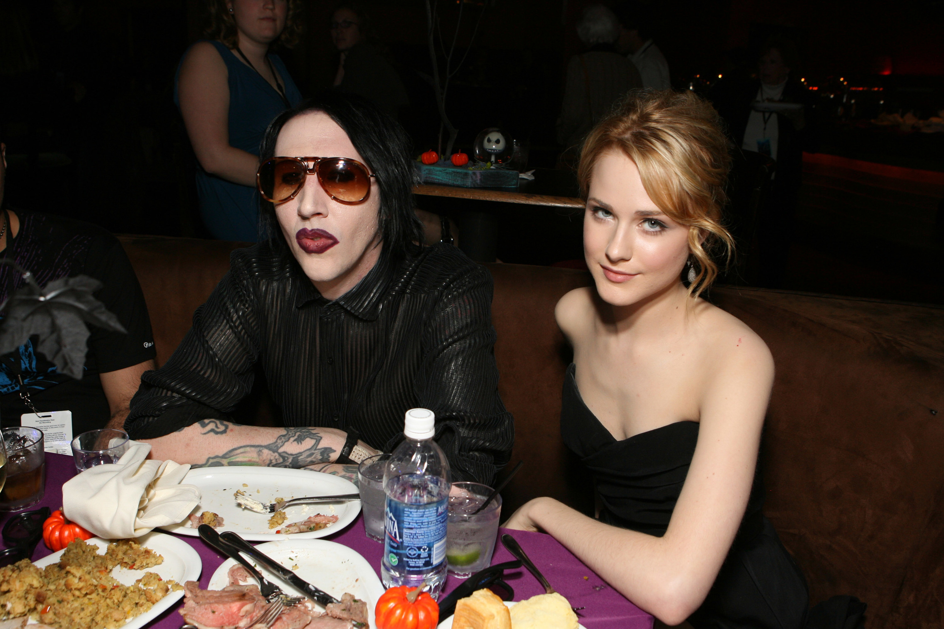 Manson and Wood sit at a table