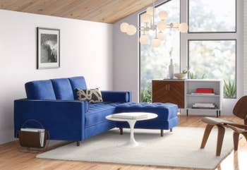 side view of the blue couch in a living room