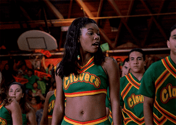 Gabrielle Union cheerleading in Clovers uniform