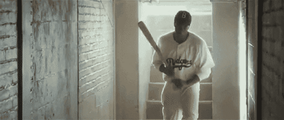 Jackie Robinson breaks bat in the dugout tunnel