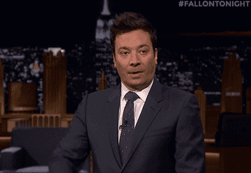 Jimmy Fallon putting his thumbs down and blowing a raspberry