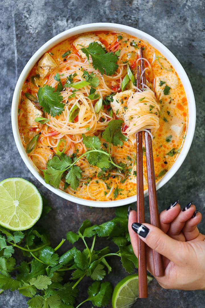 Red curry noodle soup in a bowl.