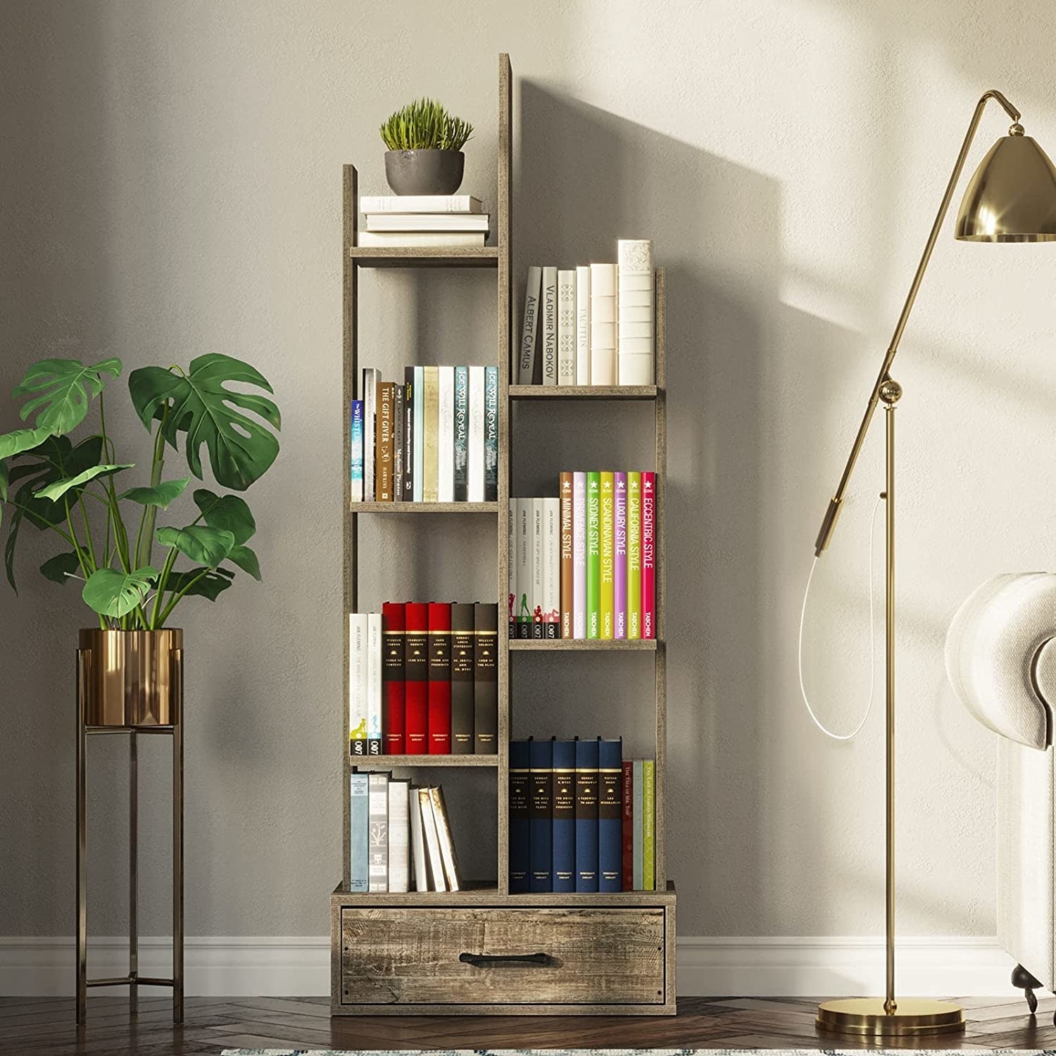 The bookshelf between a floor lamp and a potted plant