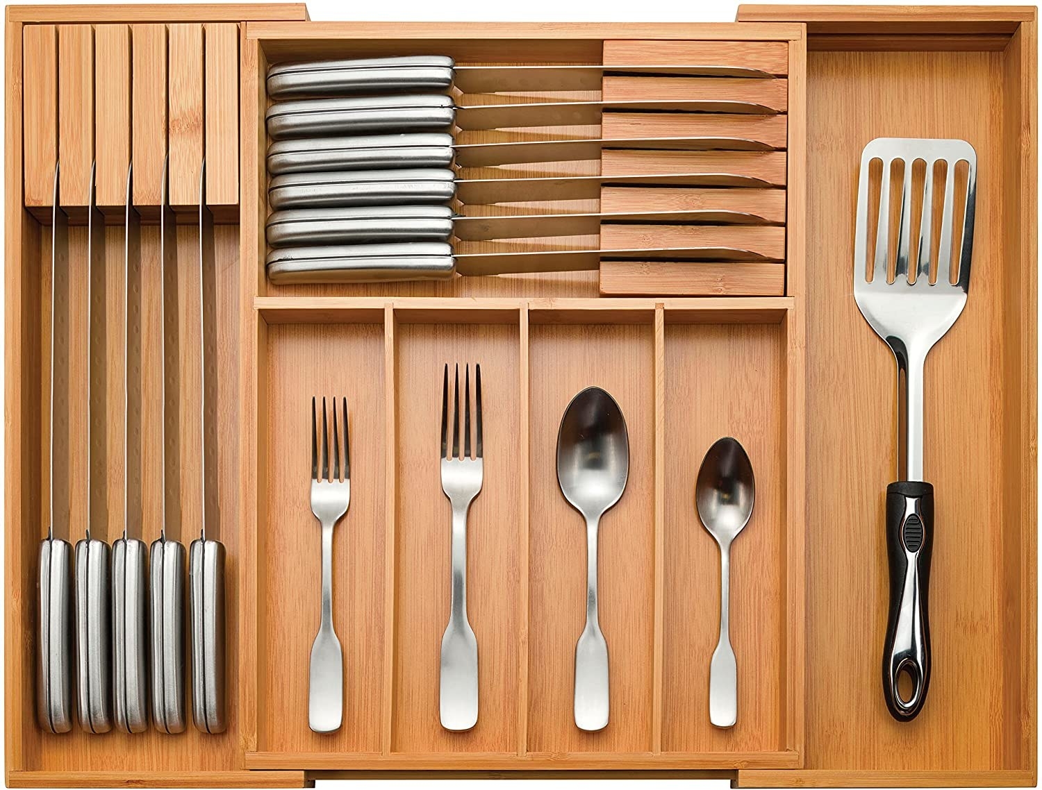 Several pieces of cutlery inside the bamboo organizer