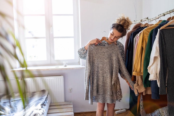 A woman picking out an outfit