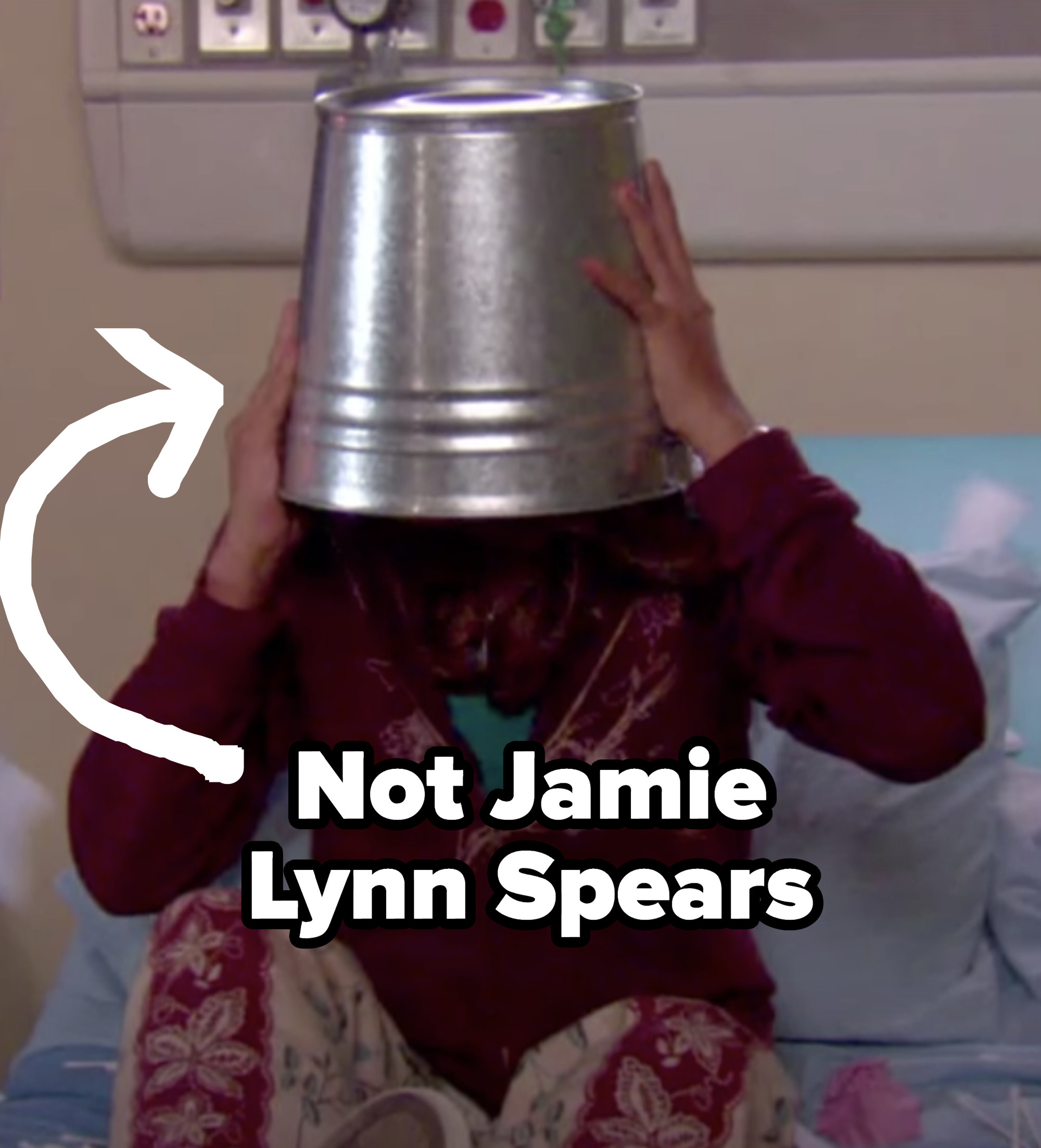 Zoey with a bucket on her head labeled &quot;Not Jamie Lynn Spears&quot;