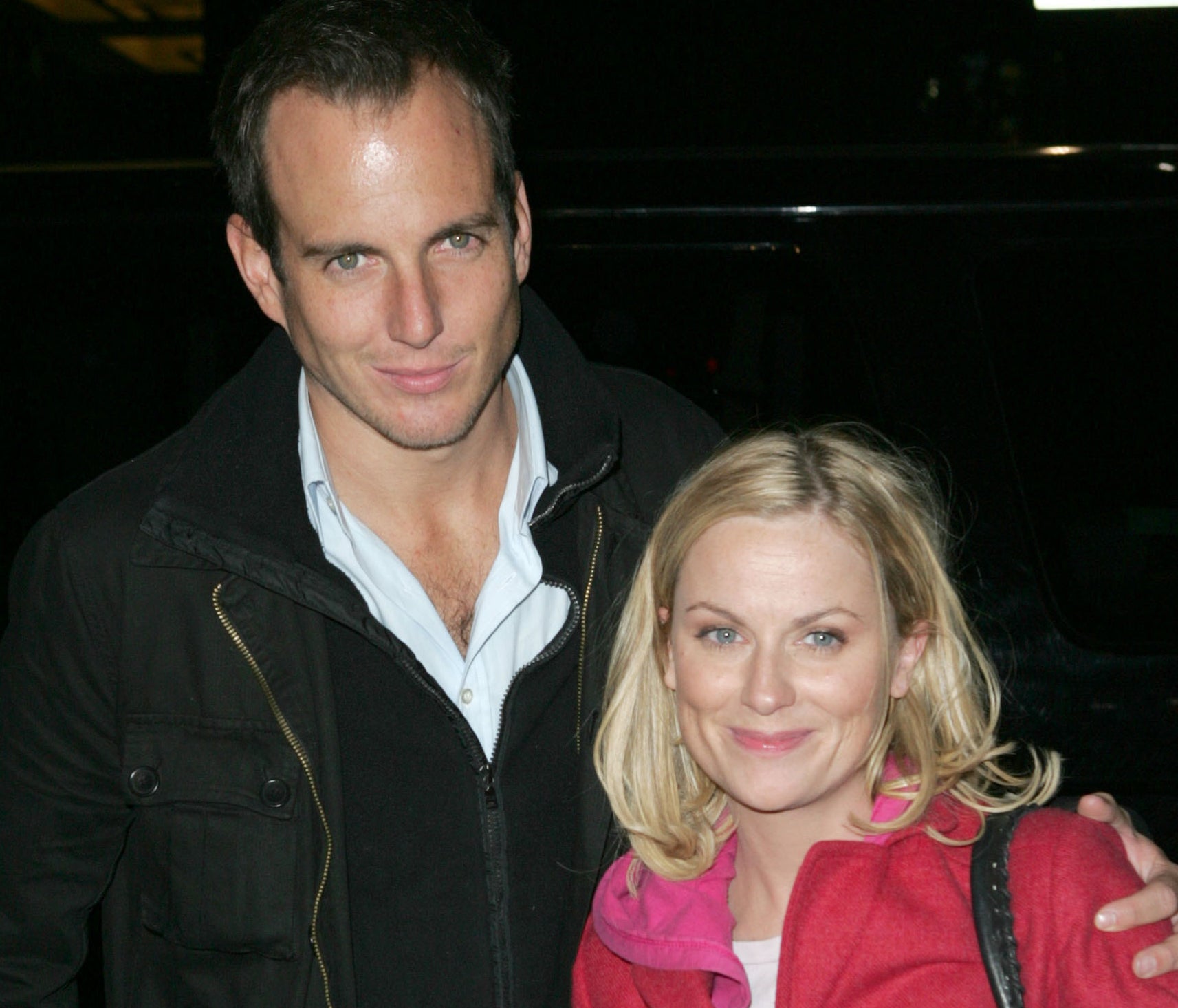 Amy Poehler and Will Arnett smiling together