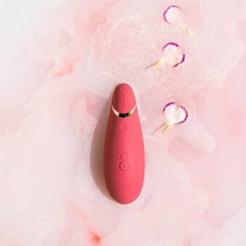Pink suction vibrator in bath
