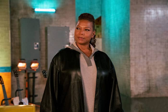 Queen Latifah standing in an industrial room in a scene from the Equalizer