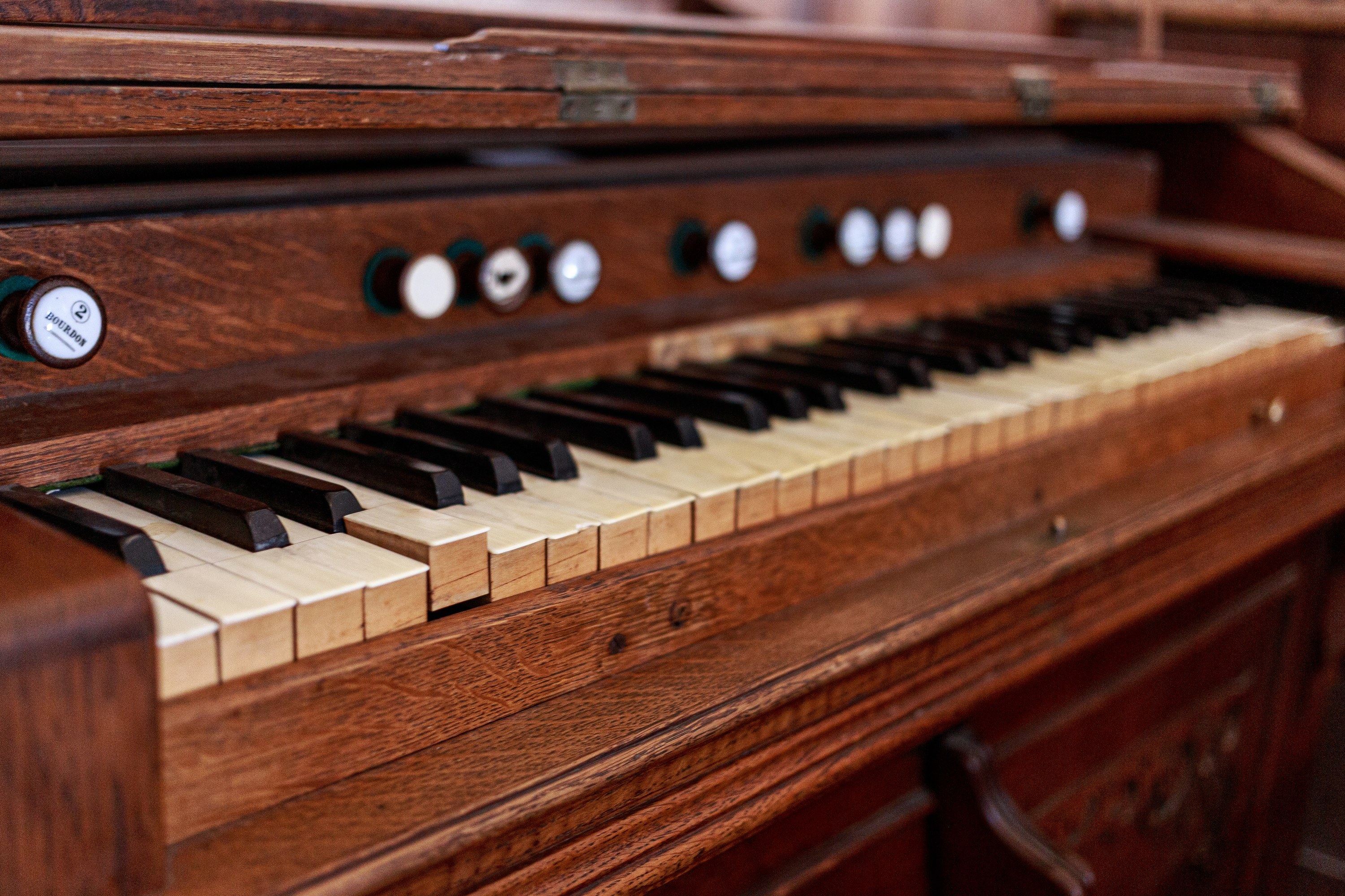 An up-close image of old piano keys
