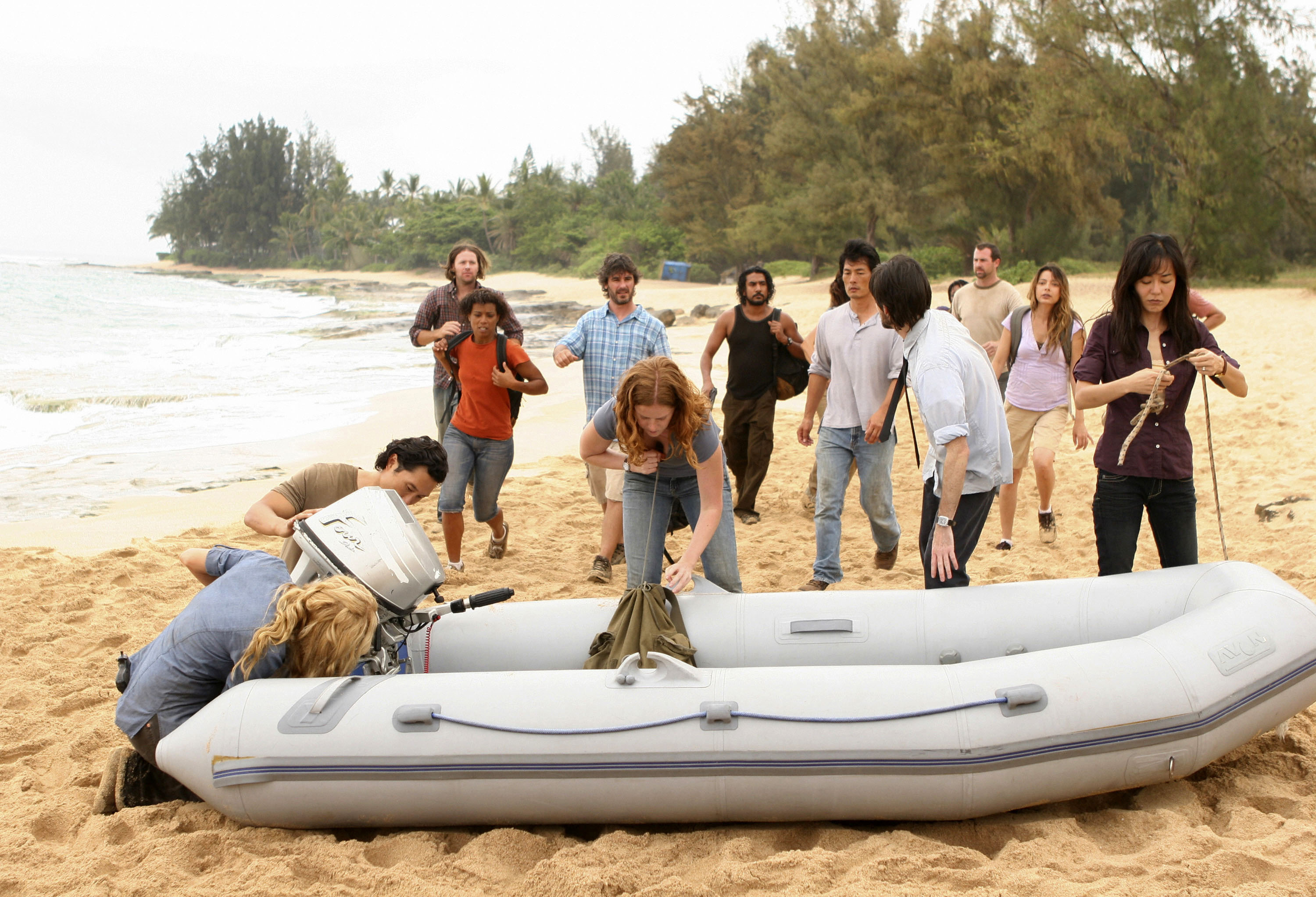 the cast runs towards an inflatable boat