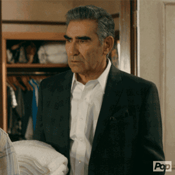 Johnny played by Eugene Levy looking distressed