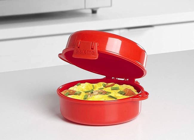 red microwave egg cooker on a kitchen counter