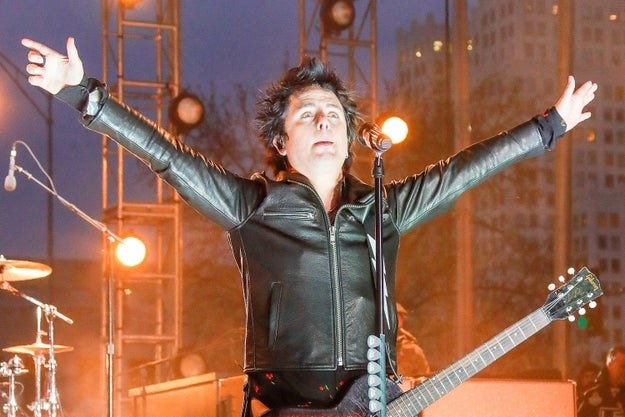 Green Day lead singer Billie Joe Armstrong gestures to the crowd during performance prior to the 2020 NHL All-Star Game
