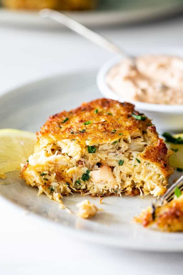 Crab cake with a bite taken out of it