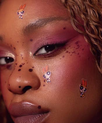 model wearing buttercup pimple patches on face