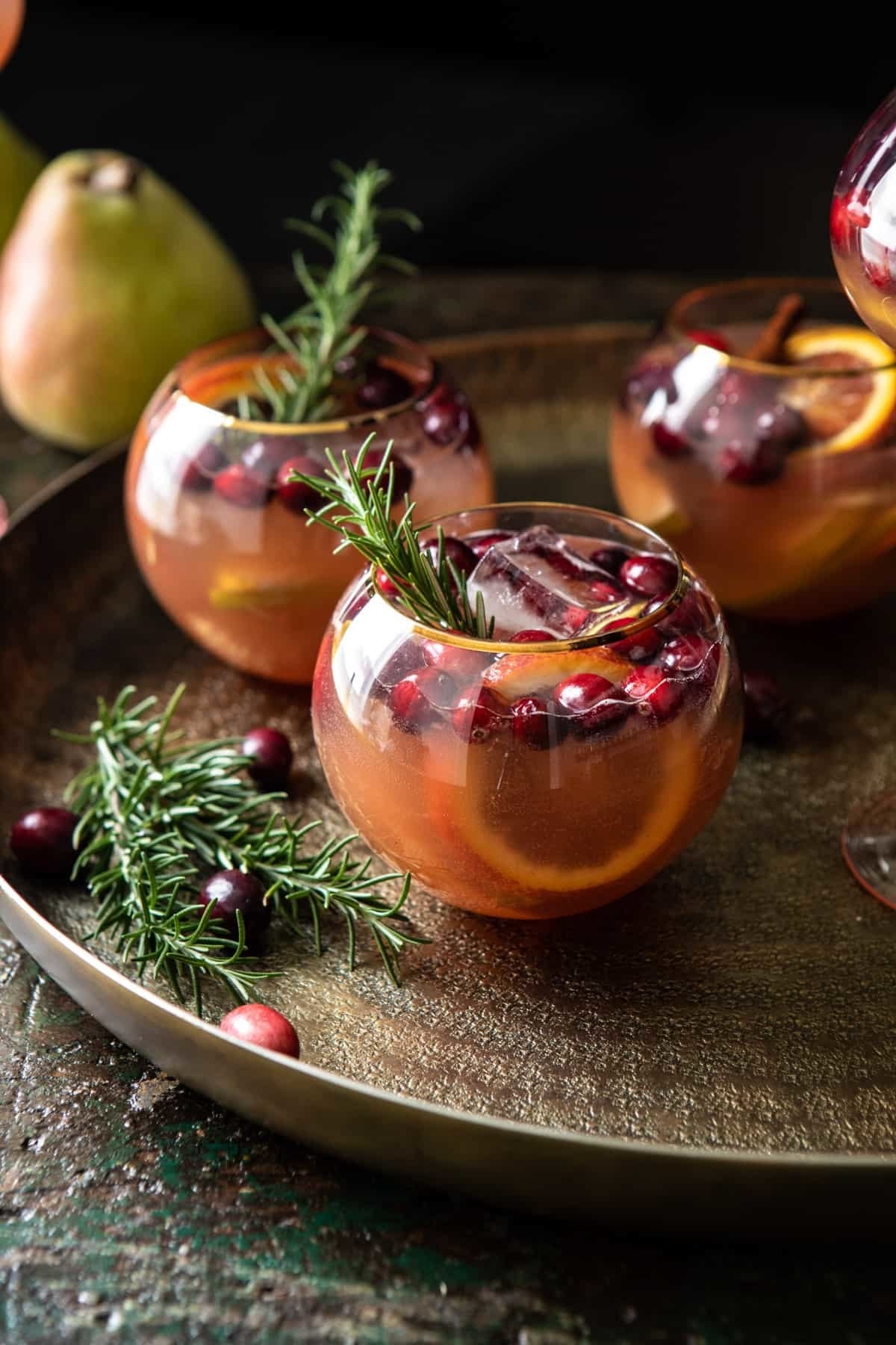 Glasses of pear and cranberry beverage