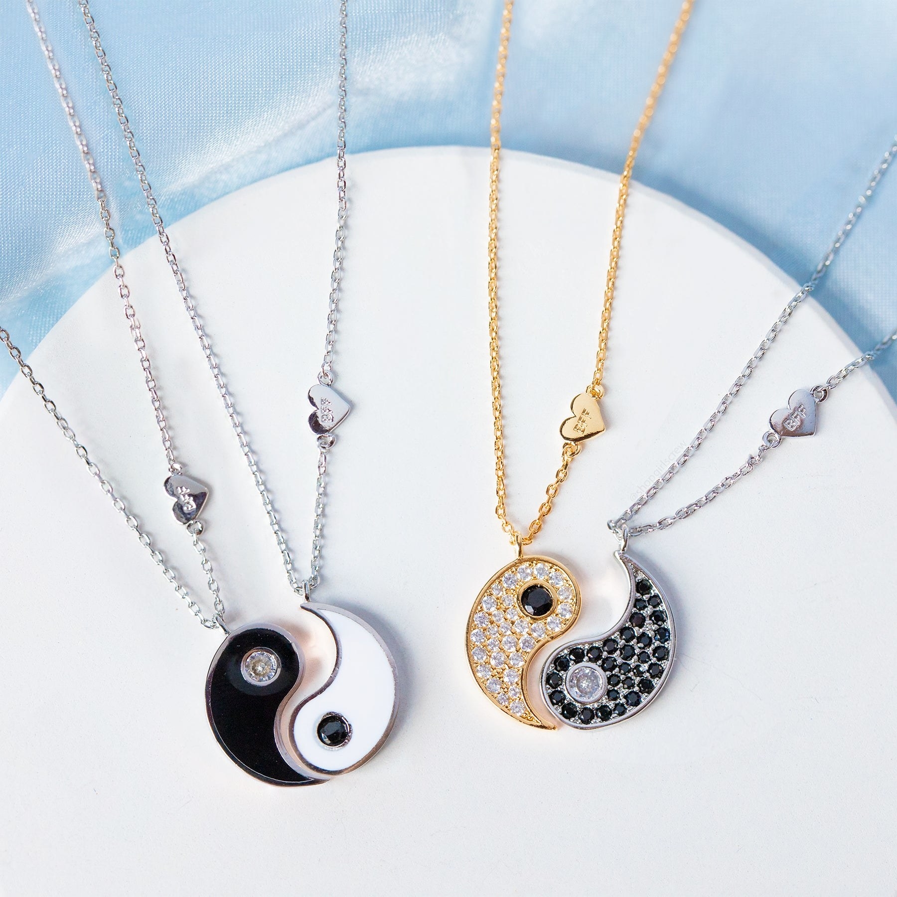 Two sets of yin and yang necklaces