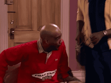 a gif of two character on the show &quot;Living Single&quot; giving each other enthusiastic hugs