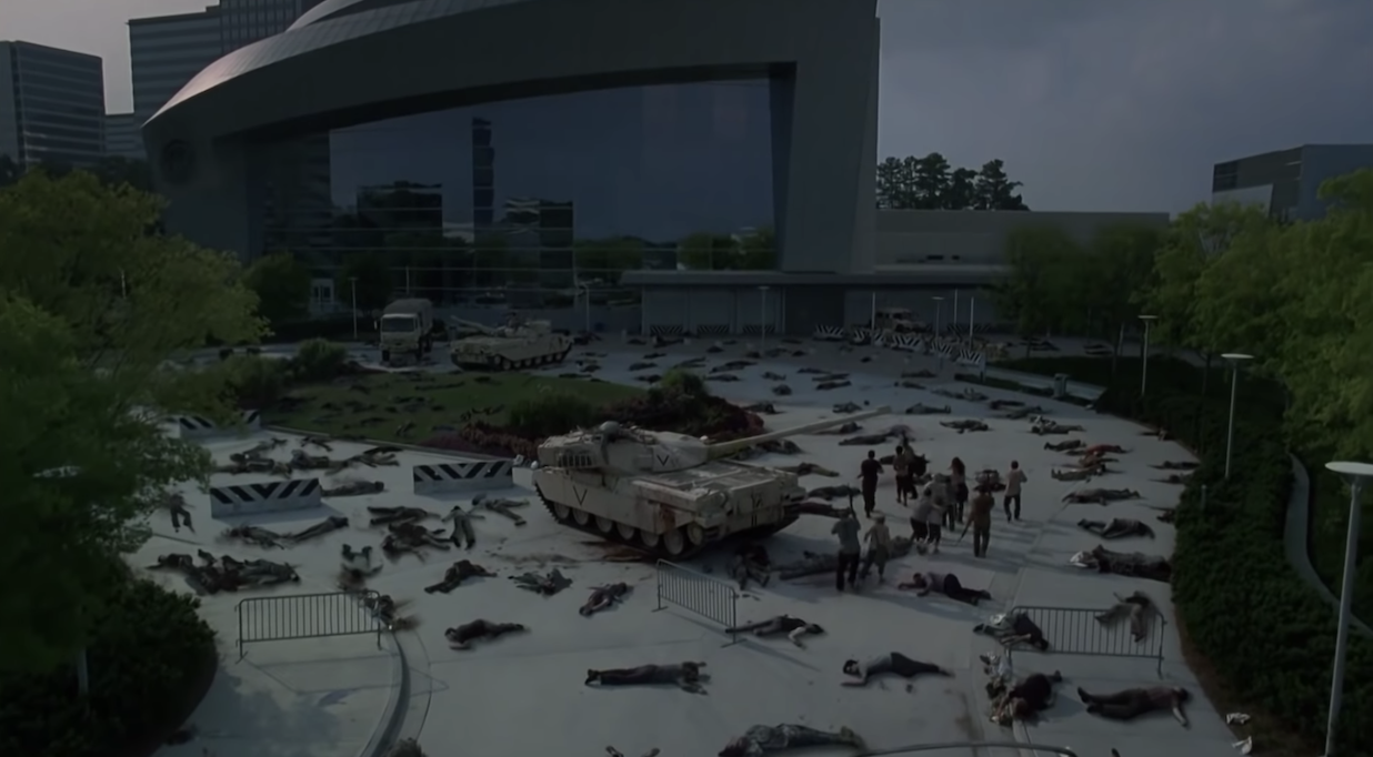 the group approaching the CDC building, which is surrounded with dead walkers