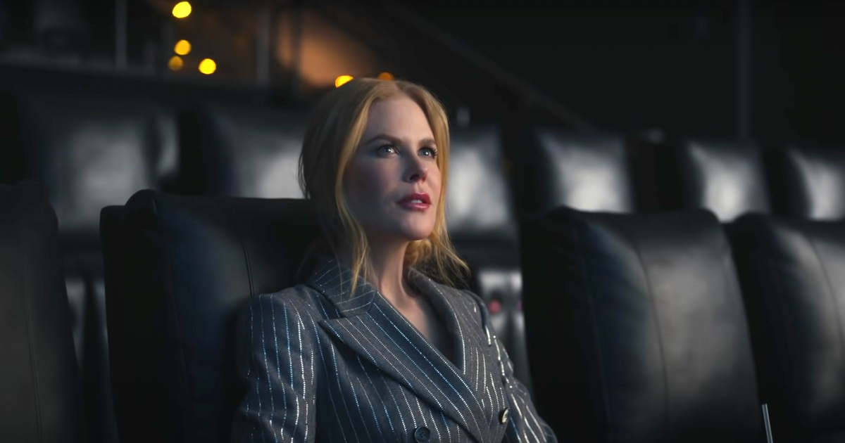 Nicole Kidman sitting in an otherwise empty movie theater