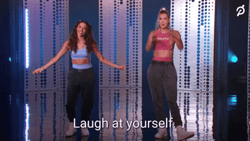Two women wearing exercise gear and long pants saying &quot;Laugh at yourself&quot;