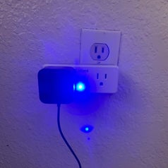 A reviewer's plug with a bright blue light