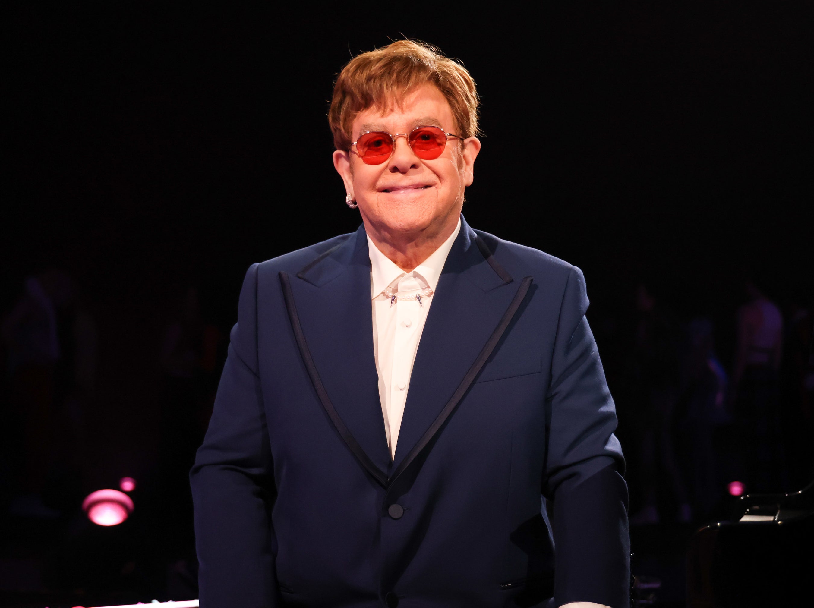 Elton smiles onstage