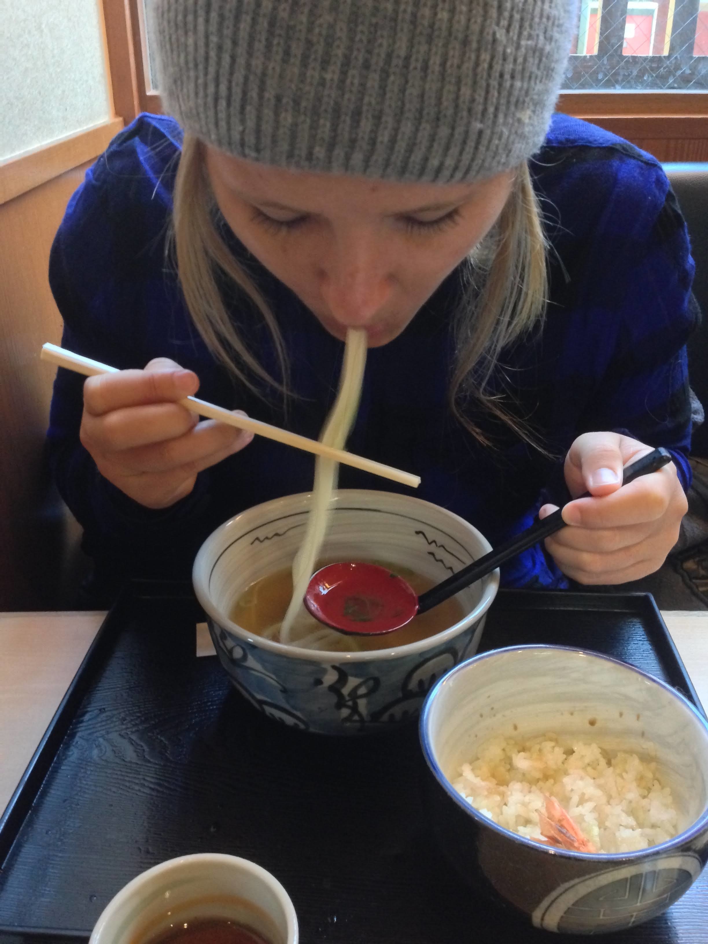 Woman slurping noodles