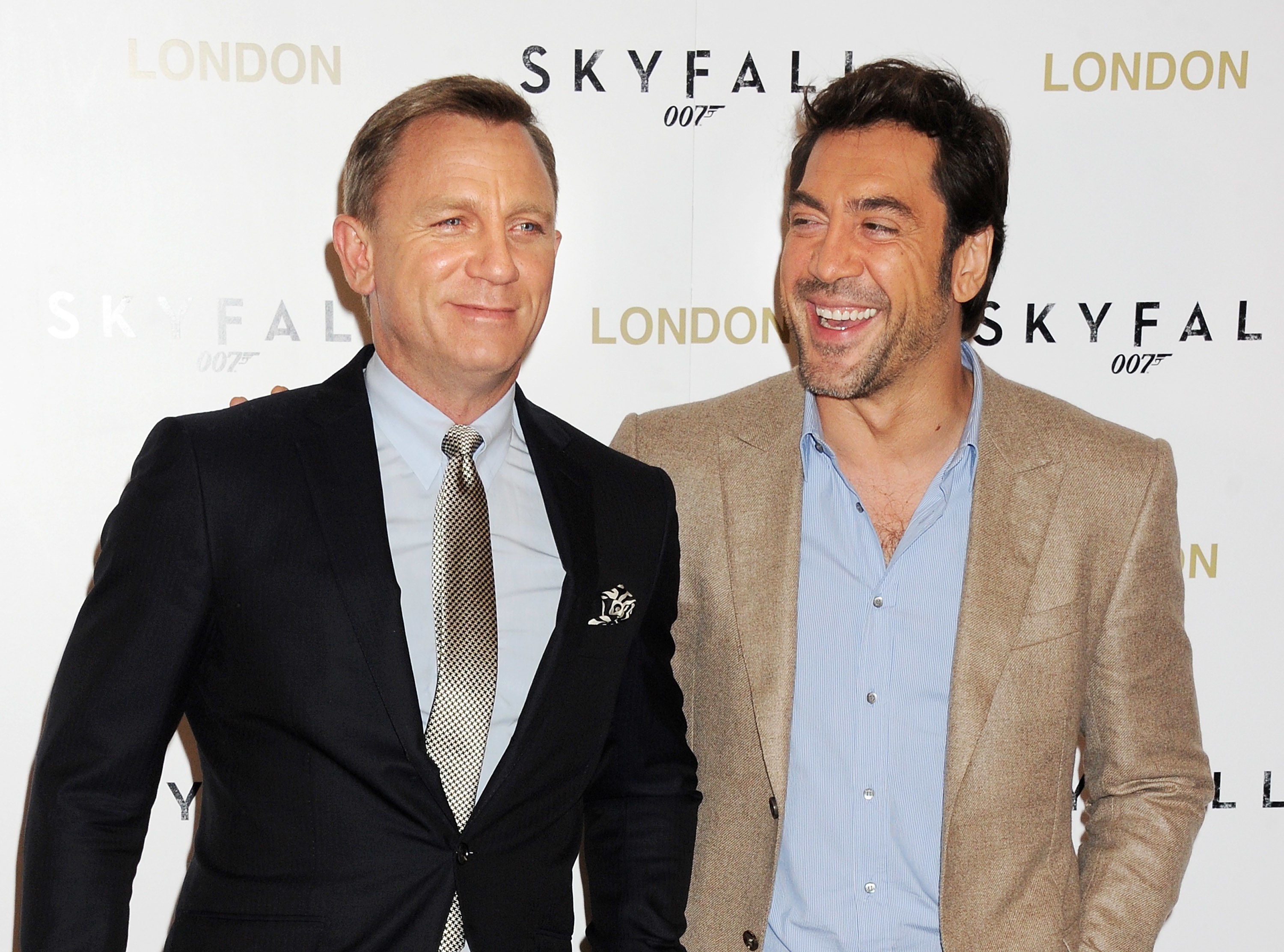 Javier and Daniel smile on a red carpet together