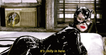 Michelle Pfeiffer as Catwoman lying on a sofa saying &quot;It&#x27;s chilly in here&quot;