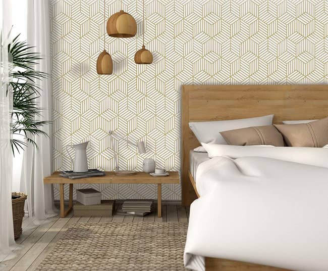 gold geometric wallpaper in a bedroom