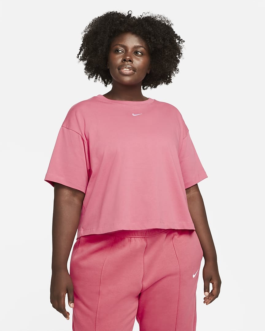Model wearing pink t-shirt and matching bottoms