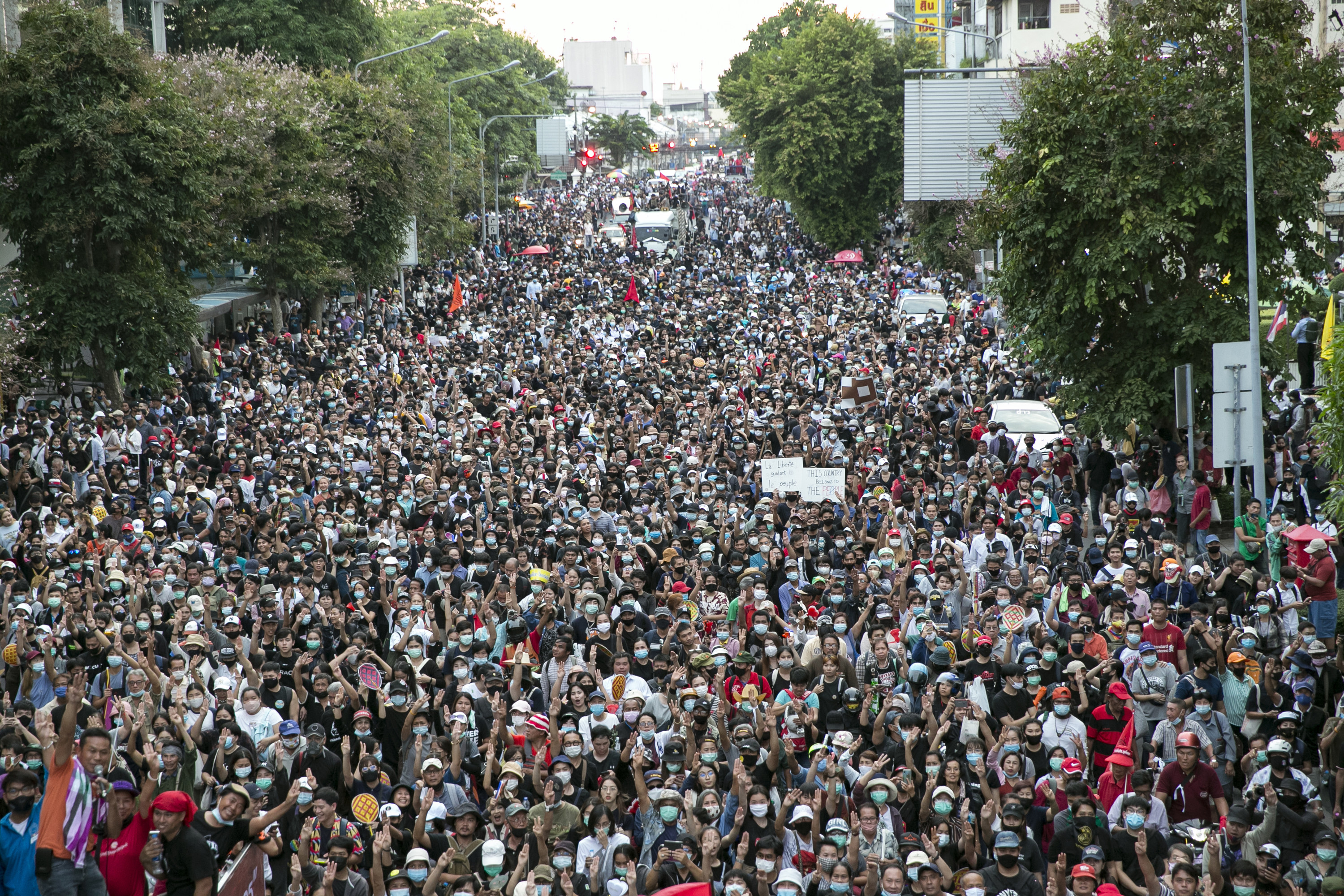 Crowds of people walking outside in the street