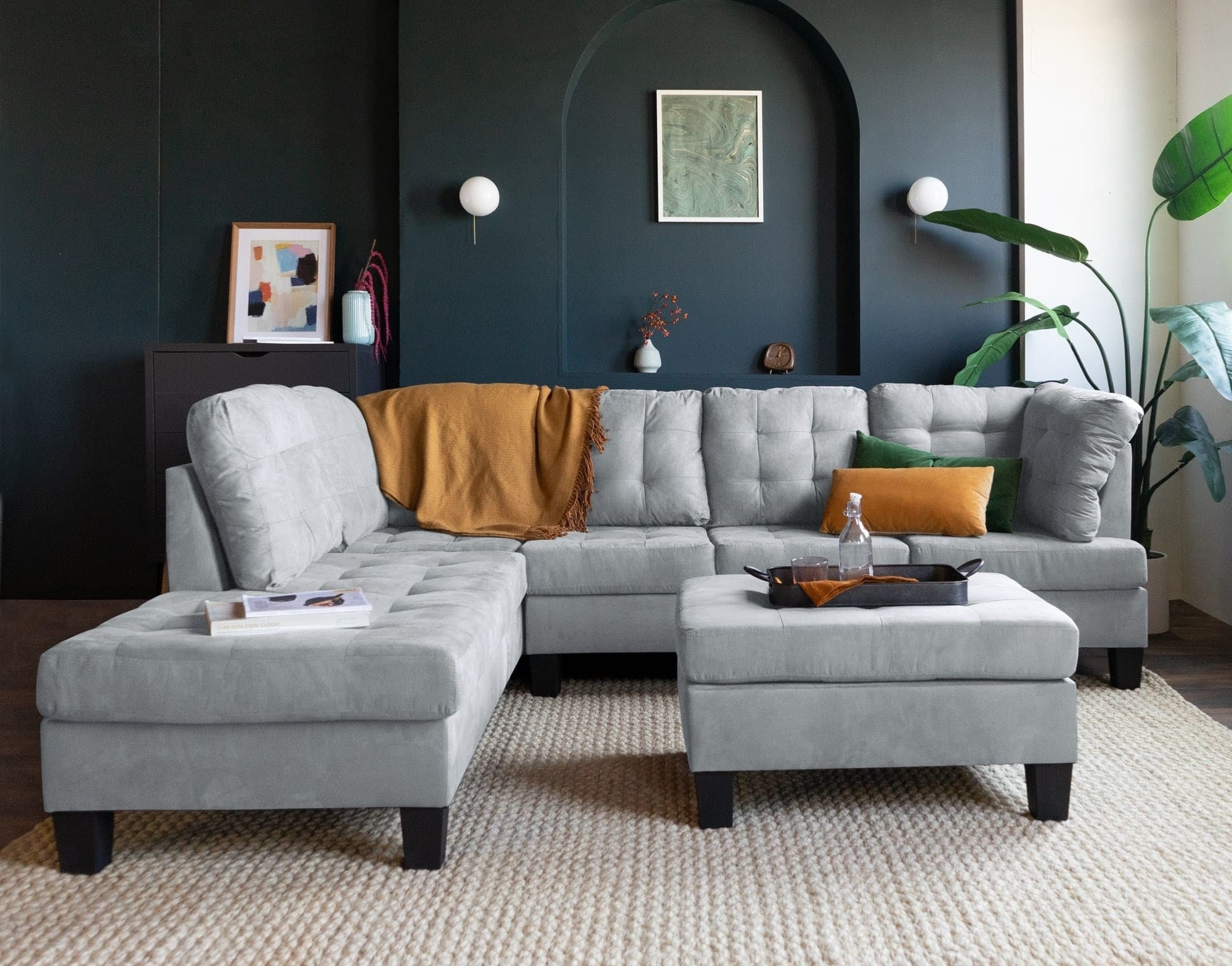 Light gray three-piece sectional set in a living room